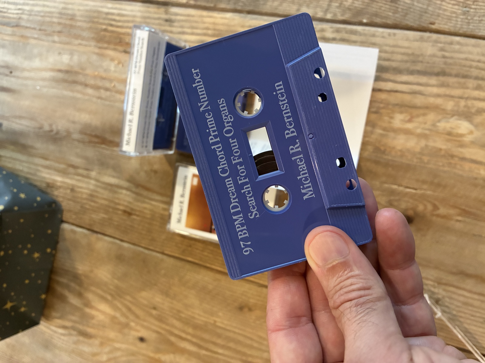 Blue cassette with white printing: 97 BPM Dream Chord Prime Number Search For Four Organs, Michael R. Bernstein